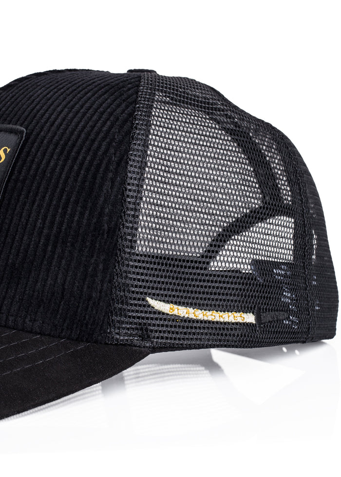 Black trucker cap with mesh back on a white background