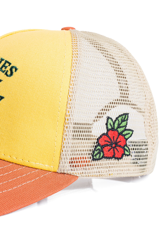 Yellow and orange trucker hat with floral design on a white background