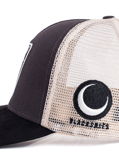 Black and white trucker cap with a logo on the mesh back