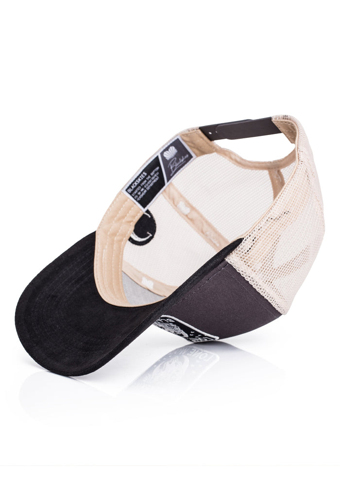 Black and beige cap on a white background